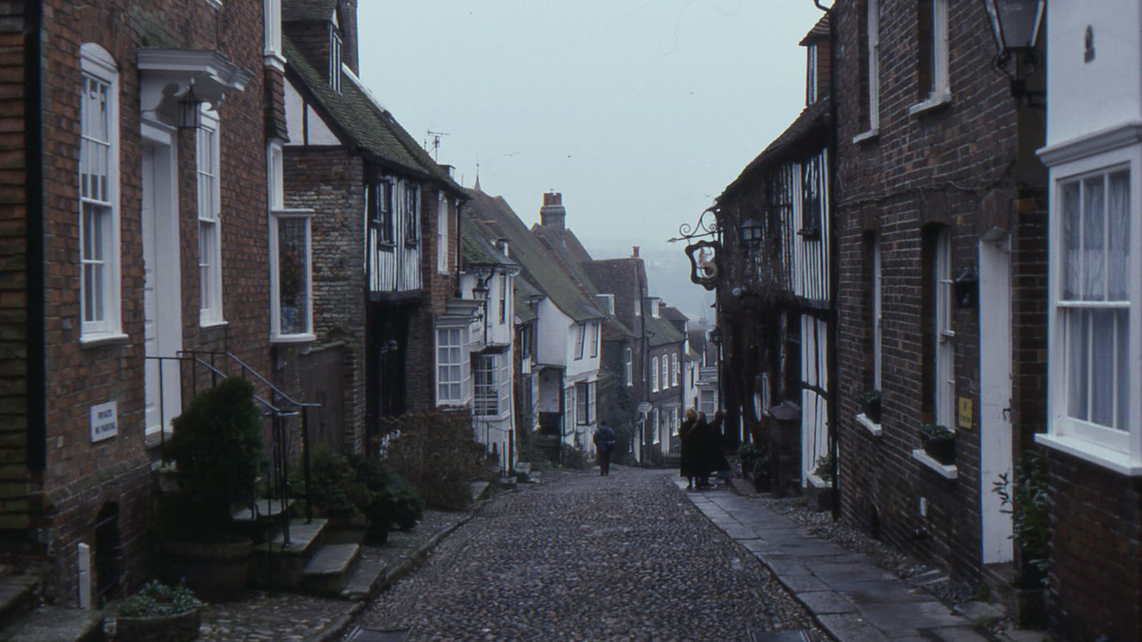 Mermaid Street in Rye, a steep cobbled lane between old brick and timber-framed houses